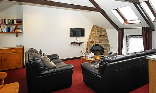 Spacious, comfortable open plan lounge with well equipped kitchen and dining area.